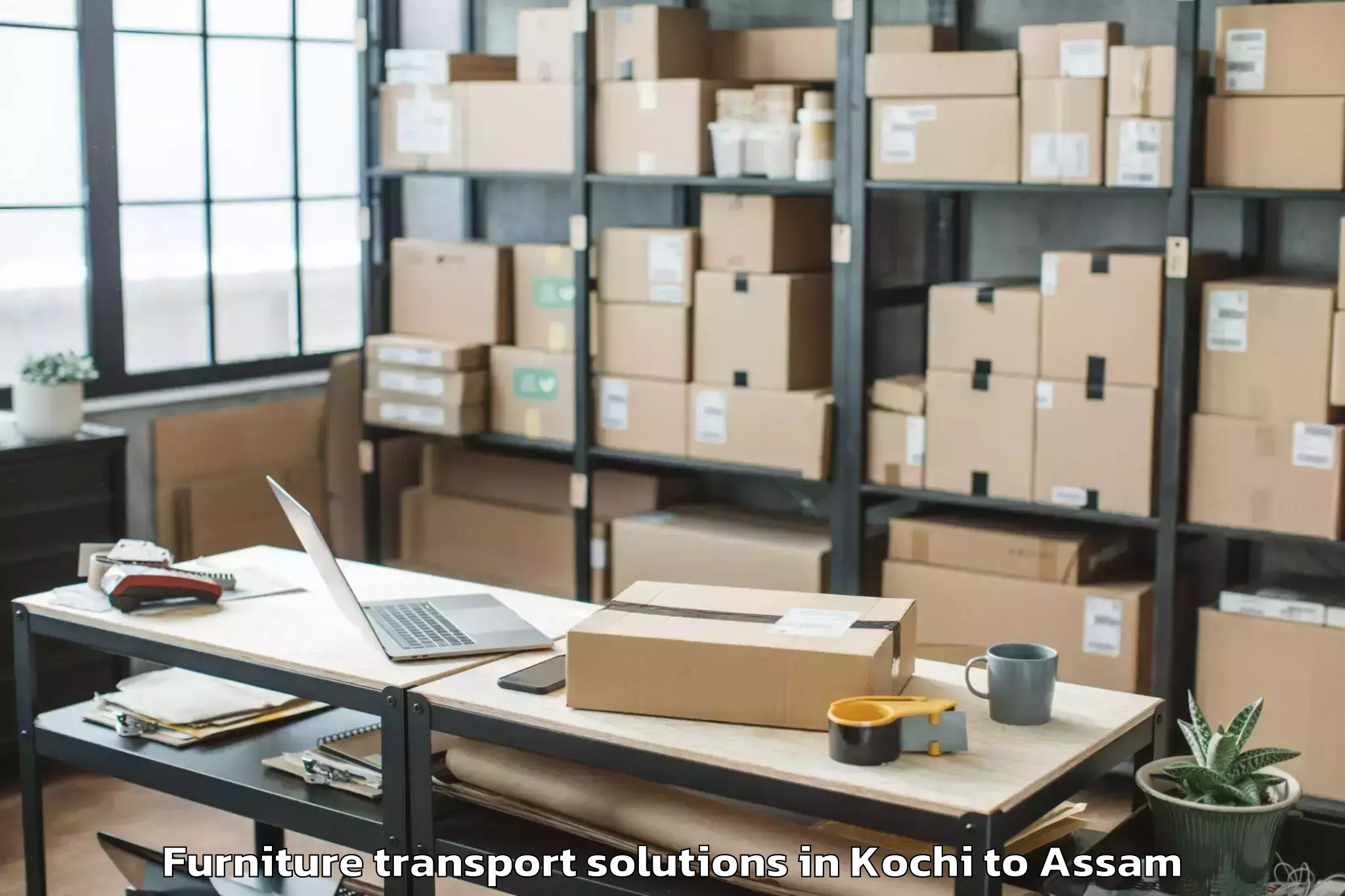 Professional Kochi to Baganpara Pt Furniture Transport Solutions